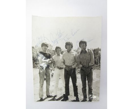 THE BEATLES: A signed 8 x 10" photograph depicting The Beatles on location in The Bahamas during filming for 'Help!', bearing