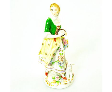 German porcelain; shepherdess playing tambourine with lamb laying by her feet. Green and white coloration; intricate floral d