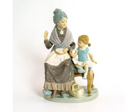 Glossy porcelain; modeled as a little girl seated on a bench with her grandmother. Lladro backstamp. Does not include origina
