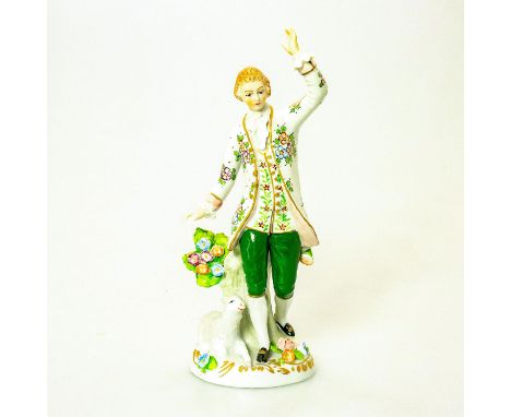 Young shepherd with lamb by his feet. Hand painted porcelain; intricate floral detail. Polychrome; gilt highlights. Chipped f