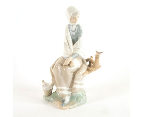 Glazed figure; Woman sitting on branch; dressed in white and light colors. No box, restored bird Issued: 1969/1985Dimensions:
