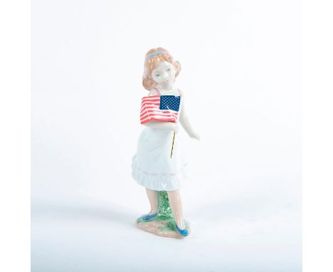 Glossy porcelain figurine; Girl with American flag. Lladro backstamp. Includes original box. Artist: Juan Ignacio AlienaIssue