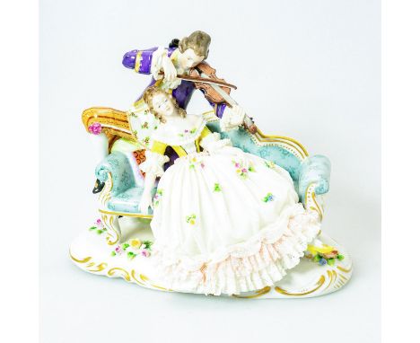 Hand made; porcelain lace detail. Woman being serenaded along a sofa by a man playing violin. This porcelain piece sits upon 