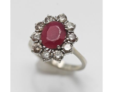 A ruby effect and diamond cluster ring set in white metal (indistinct marks), size P, approx 4.9g.