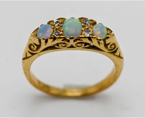 An 18ct yellow gold opal and diamond set ring, size K.