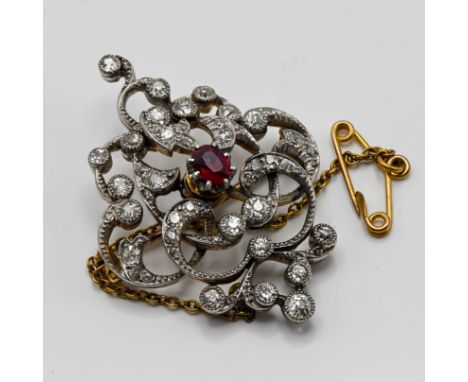 An antique diamond and ruby set brooch with safety chain, approx 35mm x 30mm
