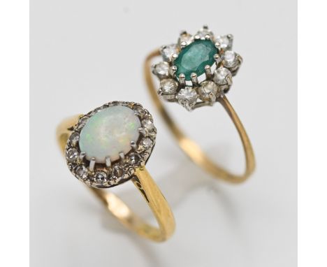 A 9ct emerald and diamond cluster ring approx 1.4g and an 18ct opal and diamond ring, approx 3.2g (2).