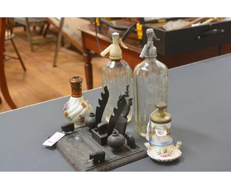 A group comprising: a Lampe Berger porcelain bottle; a 19th century French syphon inkwell with gilt-brass weighted cover; two
