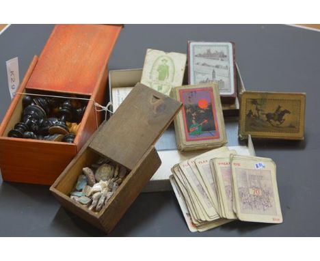 A group comprising: a boxed turned wooden chess set (complete); a box containing a quantity of mother of pearl fragments; and