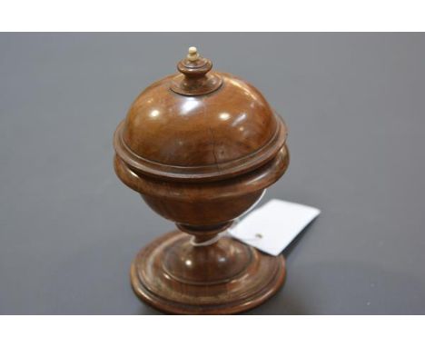 A 19th century ivory-mounted walnut string holder, of spherical form, with urn finial. 15.5cm