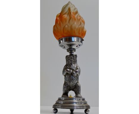 A NOVELTY ART DECO STYLE CHROME FINISHED TABLE LAMP MODELLED AS A BEAR ON STEPPED BASE WITH COLOURED FLAME STYLE SHADE     