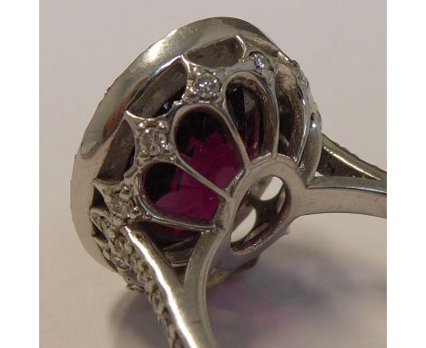 An 18-carat white-gold large rubellite and diamond cluster ringApprox. dimensions are:&nbsp; &nbsp;&nbsp;&nbsp;&nbsp;&nbsp;&n