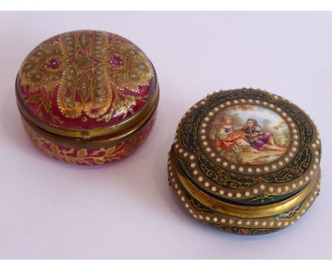A 19th century circular Cranberry glass box and hinged cover hand decorated with flower heads, leaves and ornamental design e