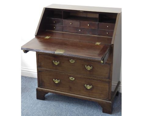 A mid-18th century mahogany (possibly Cuban?) writing bureau of good colour and small proportions, the cleated fall opening t