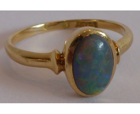 A lady's 18-carat yellow-gold dress ring centrally set with an oval cabouchon opal, ring size 'K/L'Condition is good overall,