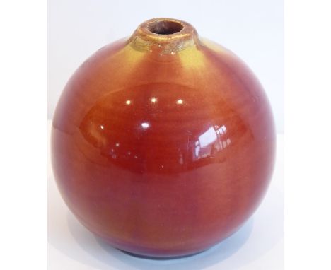 A 19th century Linthorpe pottery vase; of spherical form and with red and mustard trailing glazes, impressed Linthrope mark a