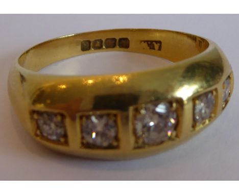 A heavy 18-carat yellow-gold ring set with a horizontal band of five graduated fine quality diamonds, ring size 'U' (boxed) (