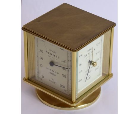 A heavy gilt-metal and glass-sided revolving timepiece, barometer, hygrometer and thermometer combined; each dial signed Sewi