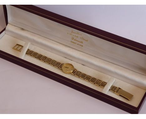 A lady's cased 9-carat yellow-gold dress wristwatch, the textured oval dial signed Rotary and with baton markers, with integr