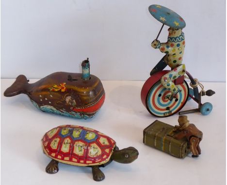 Old tin-plate toys to include a clockwork tortoise, a clockwork whale 'Billy the Ball Blowing Magic Whale', a clockwork clown