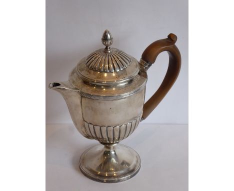 A hallmarked silver Argyle-style hot-water jug domed lobed cover surmounted with an acorn-style finial above circular body wi