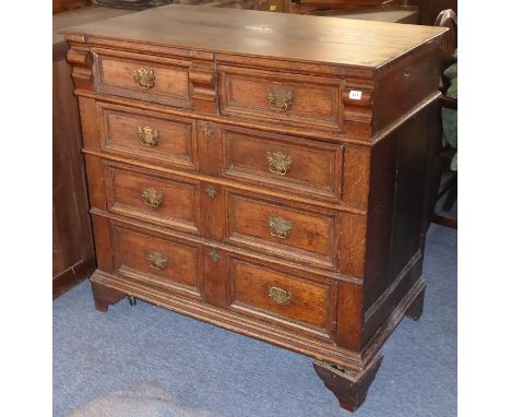 A late-17th century oak chest of large proportions (restorations etc.); two half-width over three full-width graduated drawer