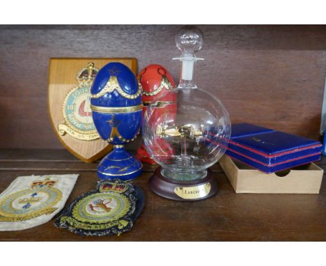 Two Bradford Exchange RAF themed eggs with model aircraft, a RAF Squadron 10 plaque, test pilot cloth badges and a playing ca