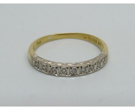 An 18ct gold and nine stone diamond ring, 3.4g, U 