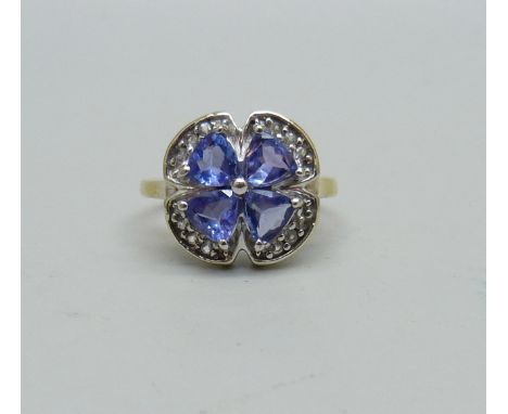 A silver gilt, tanzanite and topaz cluster ring, K 