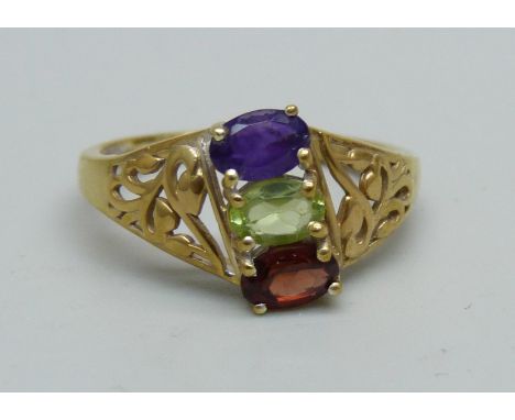 A silver gilt, amethyst, garnet and peridot ring, S 