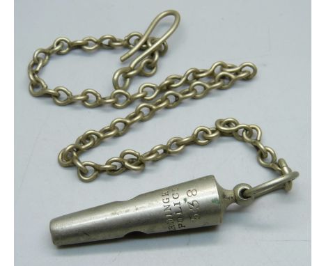 A vintage Birmingham Police 538 Whistle on a metal chain. 