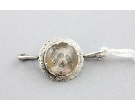 Late 19th / Early 20th century Silver Brooch with a circular central panel with an embossed portrait of a Terrier Dog