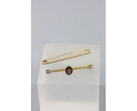 9ct Gold Bar Brooch set with an Amethyst together with another 9ct Gold Bar Brooch