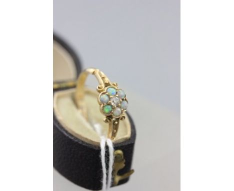 Edwardian 18ct Gold Cluster Ring comprising a central brilliant cut diamond surrounded by round cabuchon cut opals, Birmingha