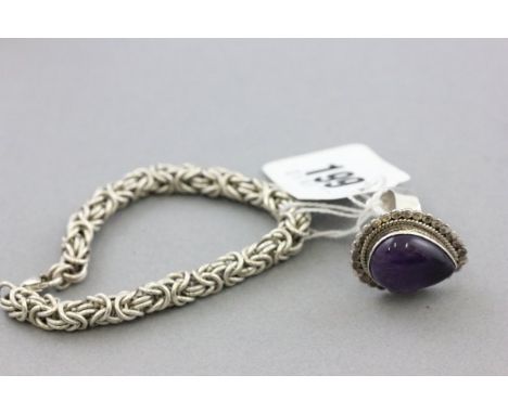 Silver Ring with Teardrop Shaped Amethyst together with a Silver Rope Bracelet
