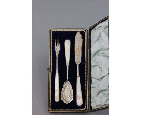 Victorian Cased Walker & Hall Three Piece Cutlery Set comprising Pickle Fork, Butter Knife and Fruit Spoon, Sheffield 1895, a