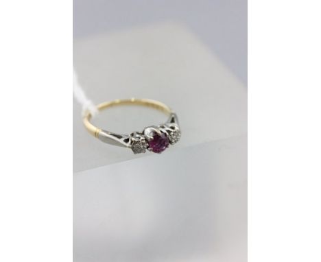 18ct Gold with Platinum Shoulders Ring set with a Ruby flanked by Two Diamonds