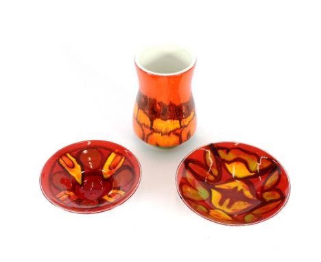 A Poole pottery beaker shaped vase, by Carole Holden, 15cms high; a Poole pottery Delphis shallow dish, shape 56, 16cms dia.;