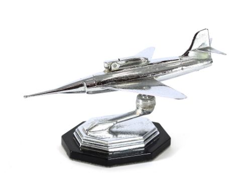 A chrome table lighter in the form of a fighter jet