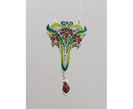 A white metal and enamel decorated Art Nouveau design pendant