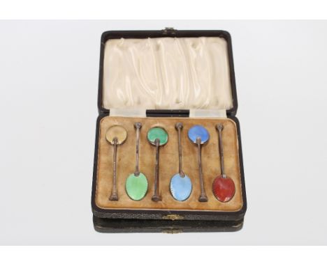 A cased set of silver and enamel decorated coffee spoons, with seal end terminals