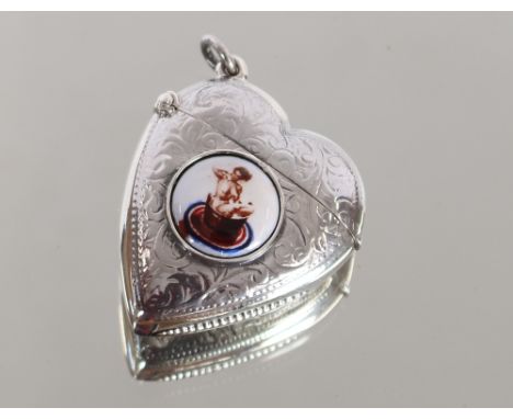A white metal and enamel heart shape Vesta
