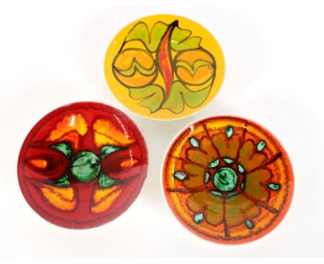 A Poole pottery Delphis ware shallow dish, decorated by Loretta Lee, circa 1970; and two others, (3)