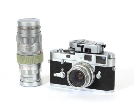 A Leica M2 camera, and various accessories including spare lens, carrying case etc.