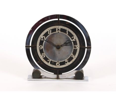 An Art Deco circular chrome mounted mantel clock 