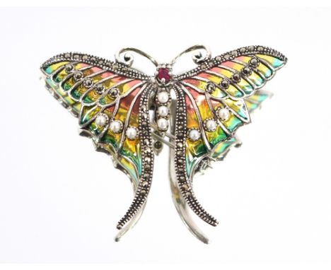 A white metal and enamel decorated butterfly brooch