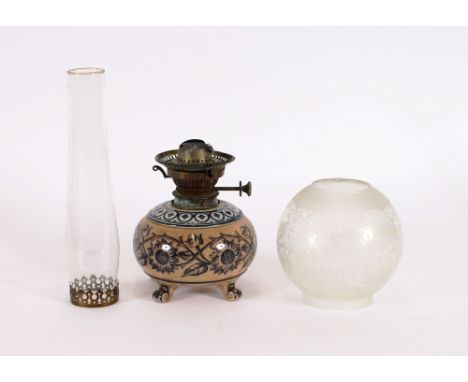 A Victorian sunflower pattern pottery oil lamp, with etched glass shade AF