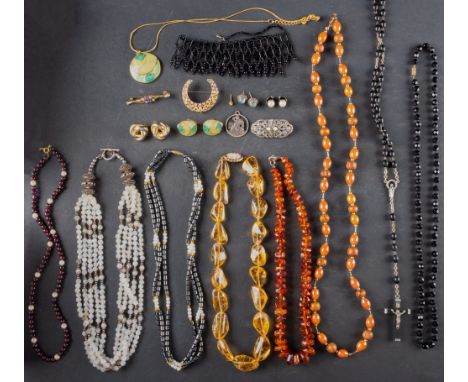 A small collection of jewellery including a citrine bead necklace; an amber bead necklace; a multi-strand moonstone bead neck