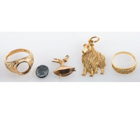 A 9ct gold dog pendant, 9ct gold ring with intaglio seal (loose), a gold ballerina pendant, a 14ct gold ring. (4)
Ring size R