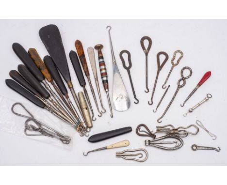 A collection of Victorian and later button hooks, including several advertising button hooks, (a lot)




